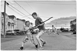 Kids playing street hockey