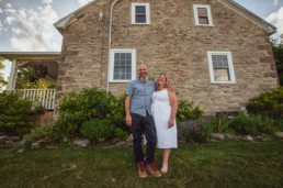 Mike Block and Sandra Bebbington-Block in front of their historic home in Vankleek Hill